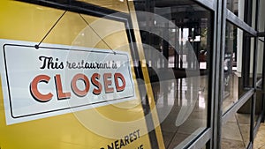 This restaurant is closed, sign in shop window in empty shopping centre