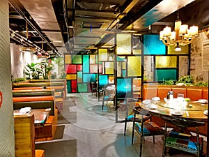 Restaurant with coloured glass partition