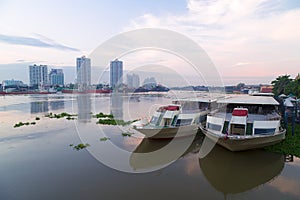 The restaurant cruise ships on Chao Phraya river and city scape in Thailand.
