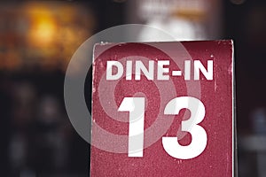 Restaurant dine in table top sign holders. Queueing serving unlucky number 13 photo