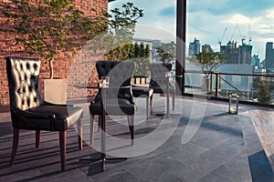 Restaurant dining table and view of business building on terrace