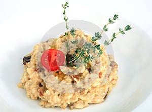 Restaurant dish, risotto with porcini mushrooms, decorated with