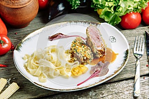 Beef medium reir with macaroni on a plate photo