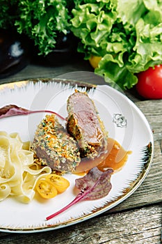 Beef medium reir with macaroni on a plate photo