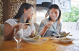 Restaurant, girl friends and lunch with food, noodles and cafe happy from bonding. Asian women, eating and plate