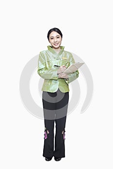 Restaurant/Hotel Hostess in traditional Chinese clothing holding clipboard