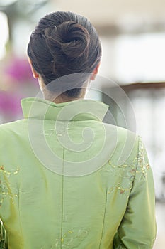 Restaurant/Hotel Hostess in Traditional Chinese Clothing, View From Behind, in Restaurant