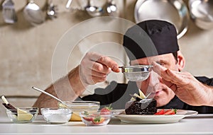 Restaurant hotel private chef preparing dessert chocolate cake