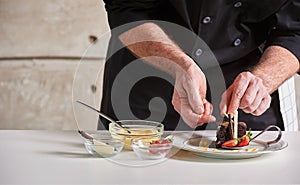 Restaurant hotel private chef preparing dessert chocolate cake