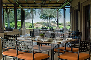 Restaurant interier with tables chairs and set up at desert resort