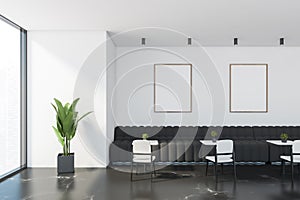 Restaurant interior with sofas and posters