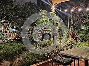 restaurant with jungle tree and small waterfall