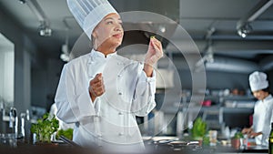 Restaurant Kitchen: Black Female Chef Fries Organic Patty on a Pan, Seasons it and Flips Cutlet with