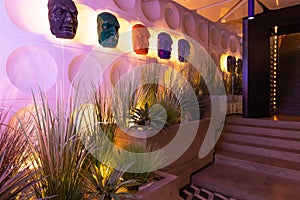 Restaurant lobby with interior lighting, Modern Stair decoration, a lot of different plants