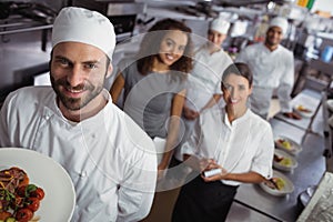 Restaurant manager with his kitchen staff