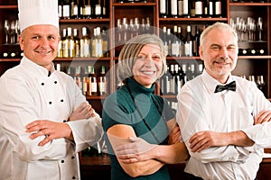 Restaurant manager posing with professional staff photo