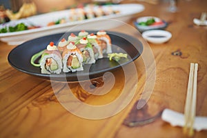 Restaurant, meal and closeup of sushi on a plate for luxury, healthy and authentic Asian cuisine. Platter, fine dining