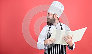 Restaurant menu, copy space. Vegetarian. Mature chef with beard. Healthy food cooking. Bearded man cook in kitchen