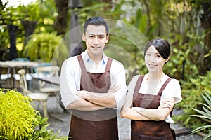 Restaurant owner standing with partner