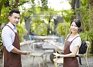 Restaurant owner with welcome gesture