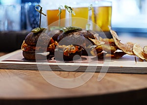 Restaurant plated dish, slider burgers and chips