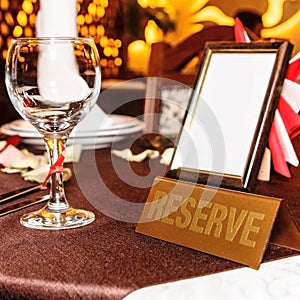 Restaurant reserved table sign with places setting and wine glass. Square picture with copy space.