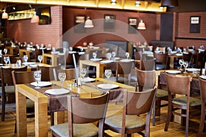 Restaurant roomy hall with wooden furniture and photo