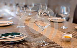 Restaurant table for multiple diners with glasses and cutlery photo