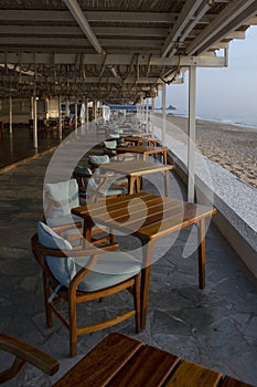 Restaurant with sea view. Empty tables at dawn. Without people.