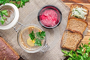 Restaurant service concept. National cuisine. Russian traditional dish - Holodets. Homemade jellied meat with garlic and spices photo