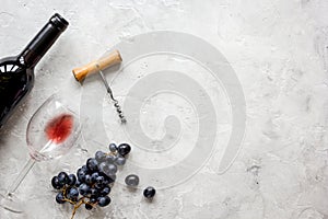 Restaurant set with wine bottle and grape on stone top view mock-up