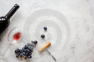 Restaurant set with wine bottle and grape on stone top view mock-up