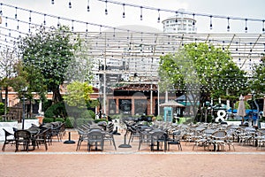 Restaurant table and chairs settings in outdoor dinning area during coronavirus restrictions waiting to reopen