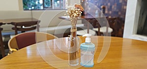 restaurant table with hand sanitizer dispenser