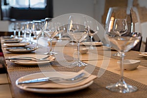 Restaurant table for multiple diners with glasses and cutlery 2