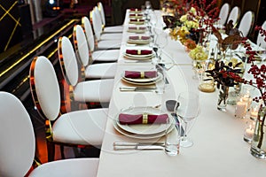 Restaurant table with napkins and wine glasses