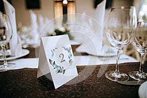 Restaurant table number. Decoration of wedding tables for dinner