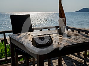 Restaurant table, with reserved sign at beach sea view