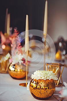 Restaurant table setout with white plates and silverware