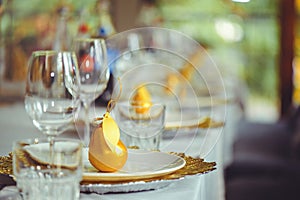 Restaurant table setout with white plates and silverware