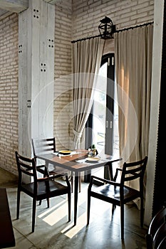 Restaurant tables near the bright window