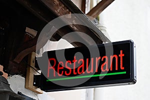 Restaurant text sign on facade building cafe pub in street