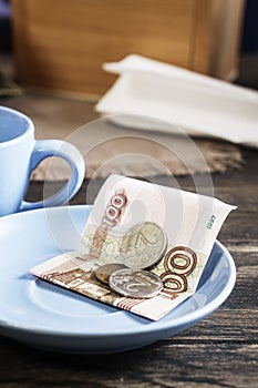 Restaurant tips in russian banknotes and coins