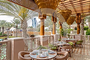 A restaurant with a view of the Burj al Arab in Dubai.