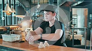 Restaurant worker is shaping a dumpling