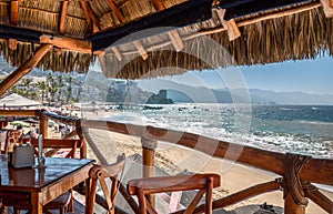 Restaurants and cafes with ocean views on Playa De Los Muertos beach and pier close to famous Puerto Vallarta Malecon, the city