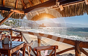 Restaurants and cafes with ocean views on Playa De Los Muertos beach and pier close to famous Puerto Vallarta Malecon, the city