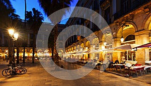 Restaurants at Placa Reial in winter evening. Barcelona