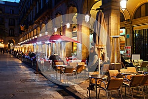 Restaurants at Placa Reial in winter night. Barcelona