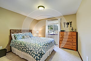 Restful bedroom boasts a wicker headboard